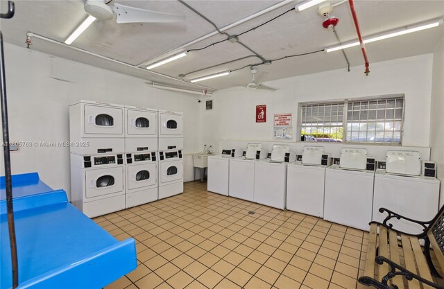 1750 W 46th St Unit 503, Hialeah, FL 33012 - communal laundry room featuring estacked washer and dryer, washing machine and dryer, ceiling fan, and light tile patterned floors