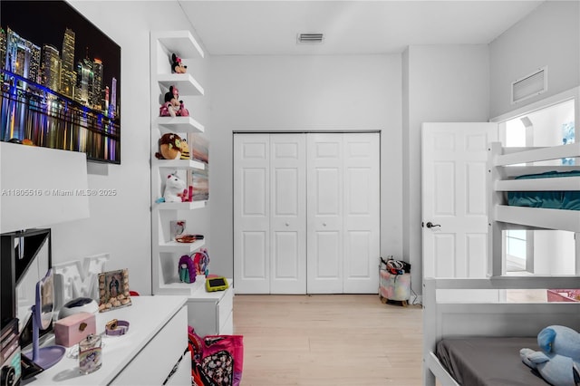 1601 SE 17th St, Homestead, FL 33035 - bedroom with light wood finished floors and a closet