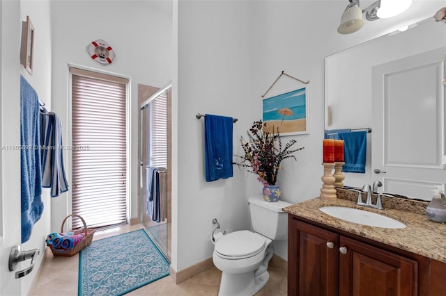 31725 SW 213th Ave, Homestead, FL 33030 - bathroom featuring a stall shower, vanity, toilet, baseboards, and tile patterned floors