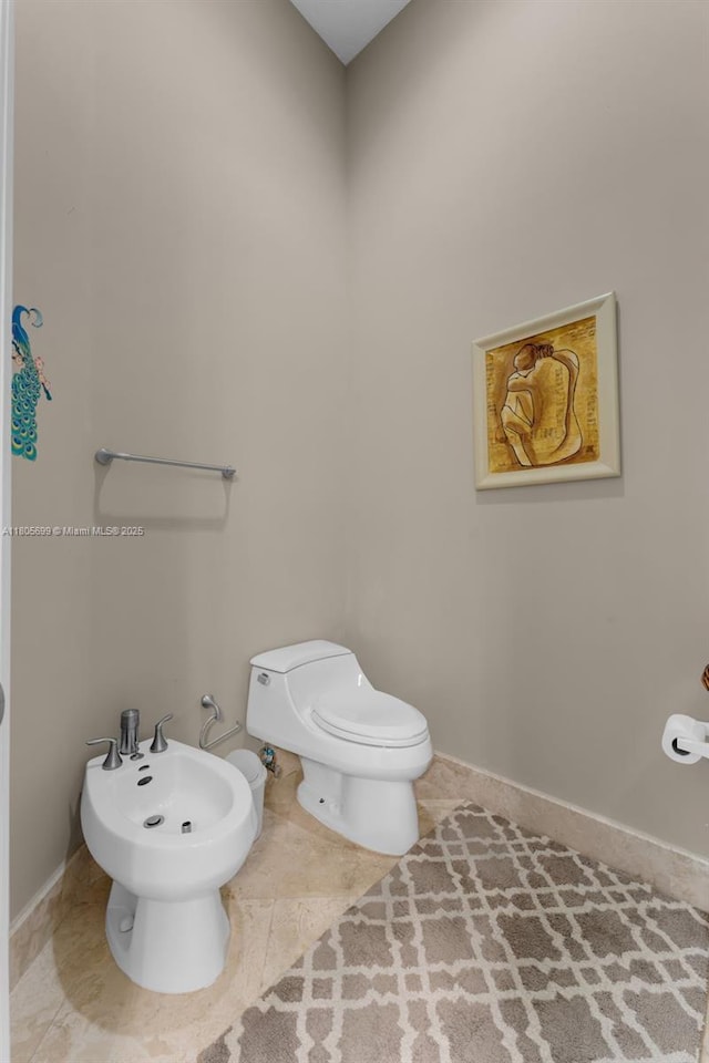 31725 SW 213th Ave, Homestead, FL 33030 - half bath with a bidet, toilet, tile patterned flooring, and baseboards