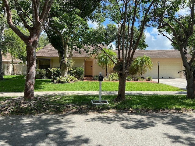 view of front of property featuring an attached garage and driveway