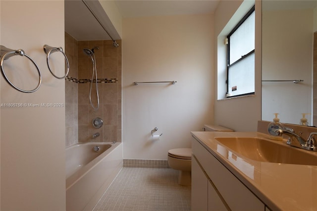 full bathroom featuring toilet, shower / bathtub combination, tile patterned flooring, vanity, and baseboards