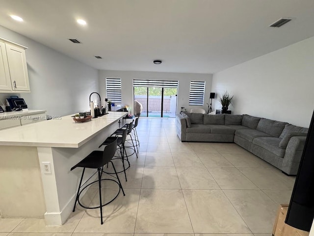living room featuring light tile patterned floors and recessed lighting