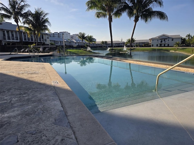 community pool with a residential view