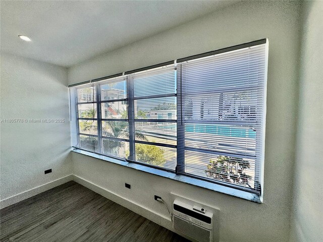 4710 Pine Tree Dr Unit 31, Miami Beach, FL 33140 - empty room featuring baseboards and dark wood finished floors