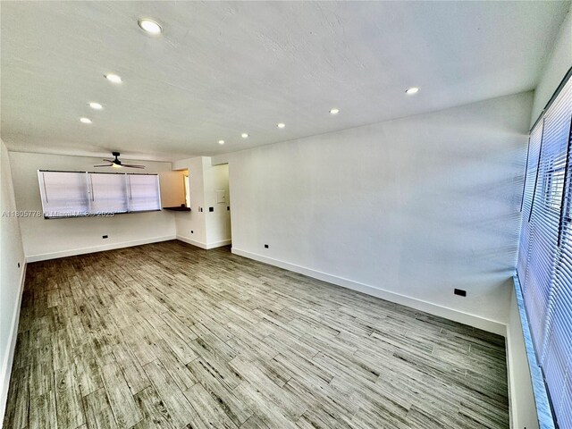 4710 Pine Tree Dr Unit 31, Miami Beach, FL 33140 - unfurnished living room with wood finished floors, baseboards, recessed lighting, and a ceiling fan