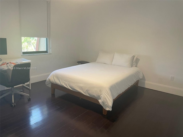 3720 NE 167th St Unit 39, North Miami Beach, FL 33160 - bedroom featuring wood finished floors and baseboards