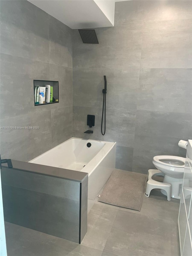 3720 NE 167th St Unit 39, North Miami Beach, FL 33160 - full bathroom featuring tile walls, a shower, toilet, a tub, and tile patterned flooring