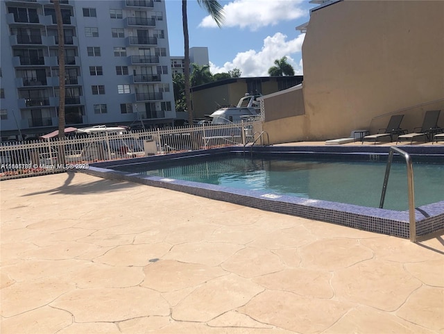 3720 NE 167th St Unit 39, North Miami Beach, FL 33160 - community pool featuring fence and a patio