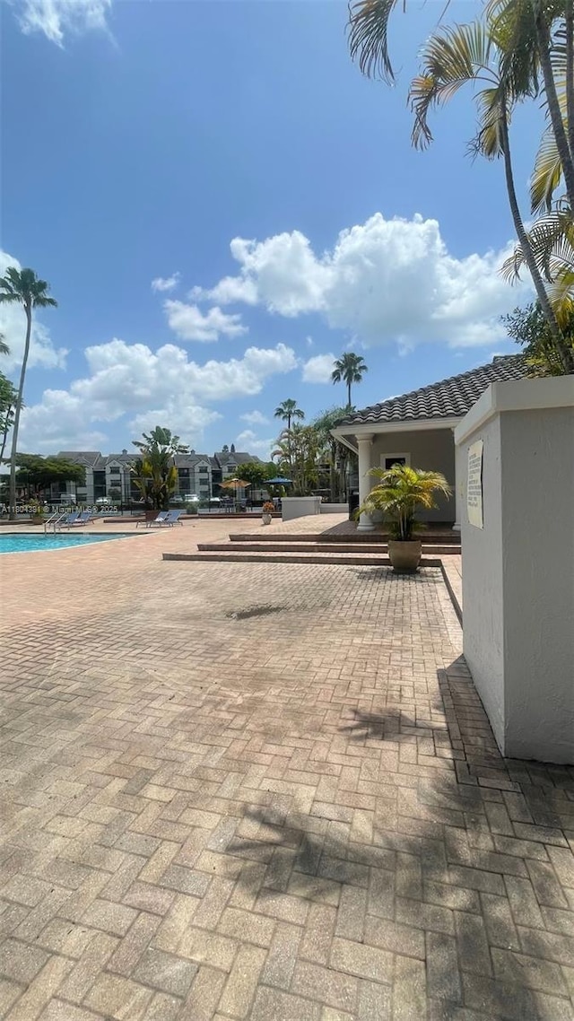 view of patio with a community pool