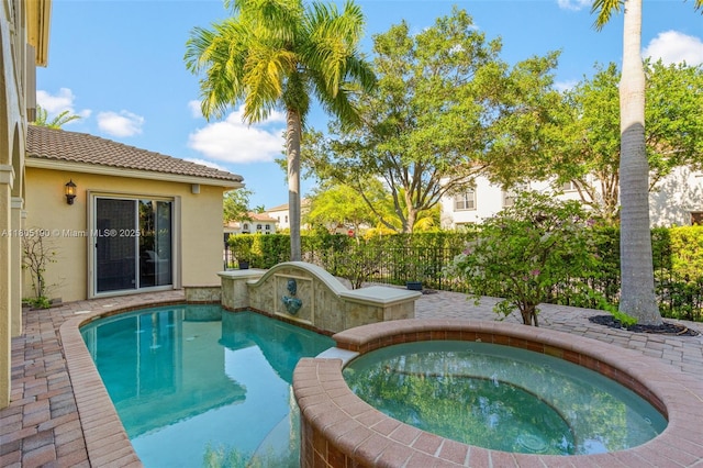9192 Nugent Trl, West Palm Beach, FL 33411 - view of pool with a fenced backyard and a pool with connected hot tub