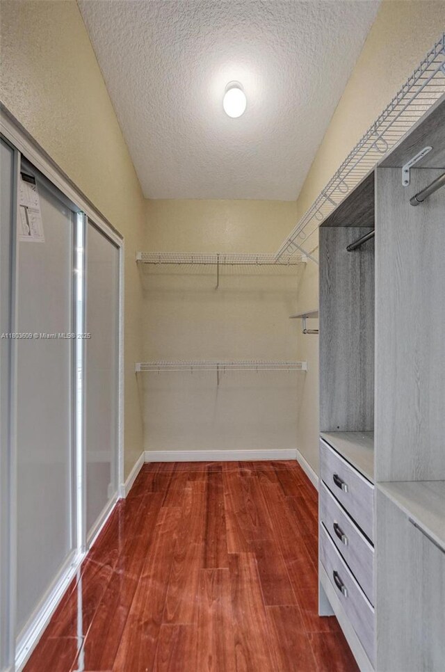 10730 NW 56th Ct, Coral Springs, FL 33076 - walk in closet with wood finished floors