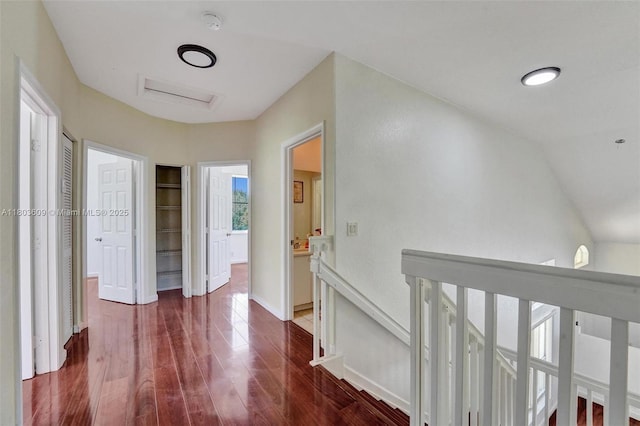 10730 NW 56th Ct, Coral Springs, FL 33076 - hallway with an upstairs landing and dark wood-style flooring