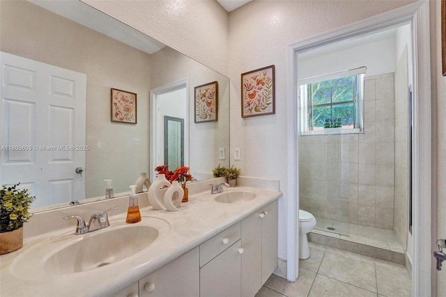 10730 NW 56th Ct, Coral Springs, FL 33076 - bathroom featuring tile patterned floors, double vanity, and a shower stall