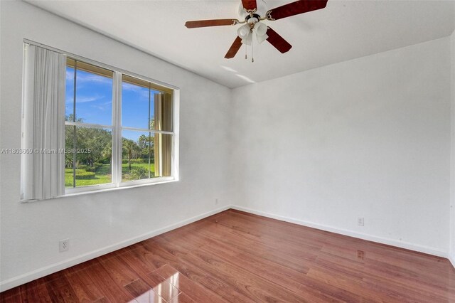 10730 NW 56th Ct, Coral Springs, FL 33076 - empty room with wood finished floors and ceiling fan