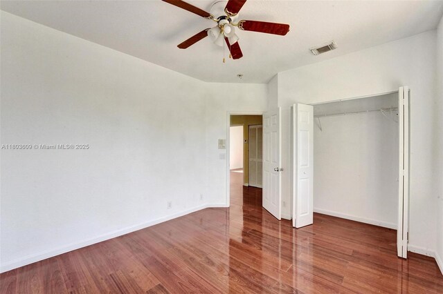 10730 NW 56th Ct, Coral Springs, FL 33076 - unfurnished bedroom featuring wood finished floors, a closet, and ceiling fan