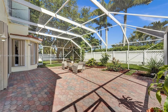 10730 NW 56th Ct, Coral Springs, FL 33076 - fenced backyard with a patio and glass enclosure