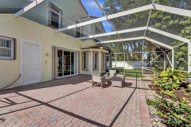 10730 NW 56th Ct, Coral Springs, FL 33076 - view of patio / terrace with a lanai