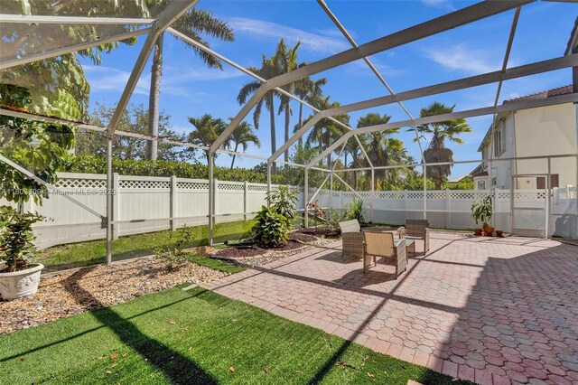 10730 NW 56th Ct, Coral Springs, FL 33076 - fenced backyard featuring a patio and a lanai