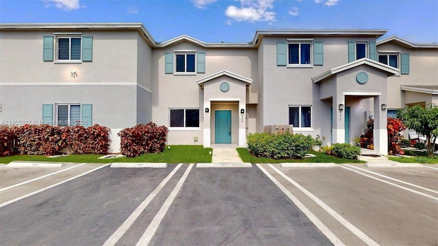 388 NW 12th Pl Unit 388, Florida City, FL 33034 - townhome / multi-family property with uncovered parking and stucco siding