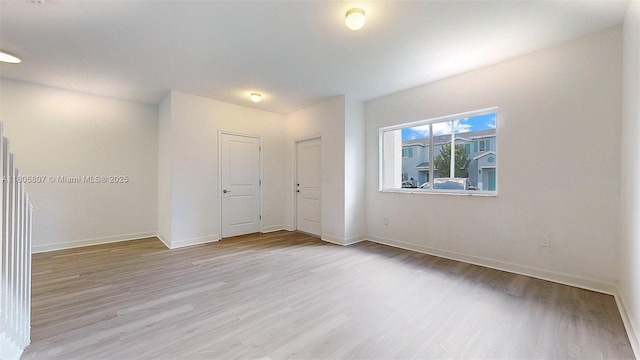 388 NW 12th Pl Unit 388, Florida City, FL 33034 - empty room with light wood-style floors and baseboards