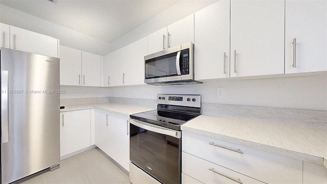 388 NW 12th Pl Unit 388, Florida City, FL 33034 - kitchen featuring stainless steel appliances, light countertops, and white cabinets