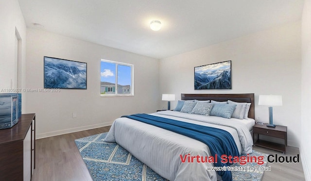 388 NW 12th Pl Unit 388, Florida City, FL 33034 - bedroom featuring wood finished floors and baseboards