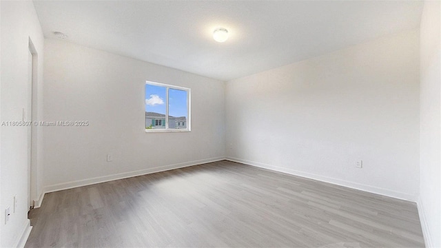 388 NW 12th Pl Unit 388, Florida City, FL 33034 - unfurnished room featuring wood finished floors, baseboards, and a smoke detector