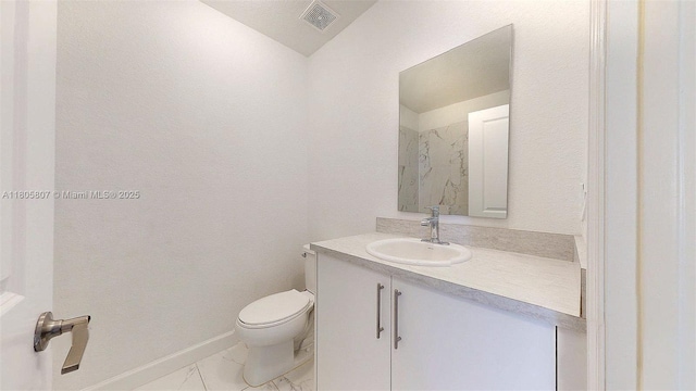 388 NW 12th Pl Unit 388, Florida City, FL 33034 - bathroom featuring vanity, toilet, and marble finish floors