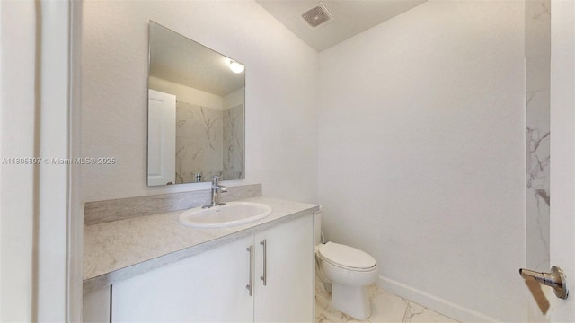 388 NW 12th Pl Unit 388, Florida City, FL 33034 - bathroom featuring toilet, vanity, and marble look tiles