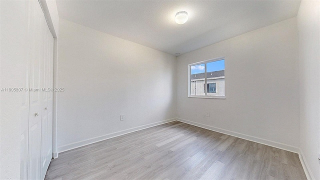 388 NW 12th Pl Unit 388, Florida City, FL 33034 - spare room featuring light wood-style floors and baseboards