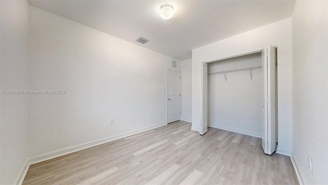 388 NW 12th Pl Unit 388, Florida City, FL 33034 - unfurnished bedroom featuring light wood-style floors, baseboards, and a closet
