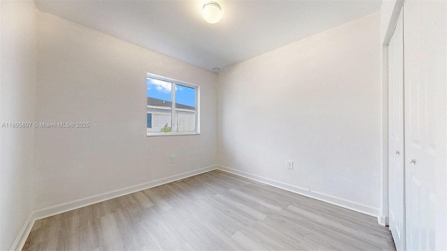 388 NW 12th Pl Unit 388, Florida City, FL 33034 - empty room with light wood-style floors and baseboards