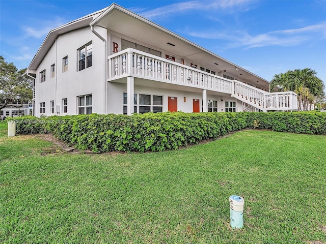 374 Tilford R Unit 374, Deerfield Beach, FL 33442 - view of home's exterior with a yard and stucco siding