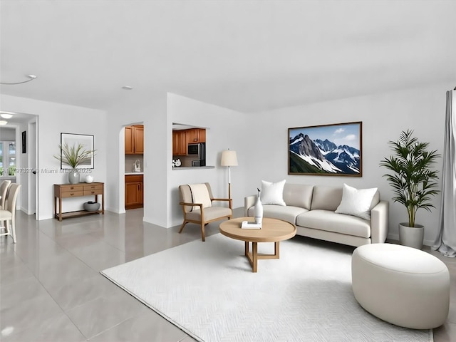374 Tilford R Unit 374, Deerfield Beach, FL 33442 - living room featuring arched walkways and light tile patterned floors