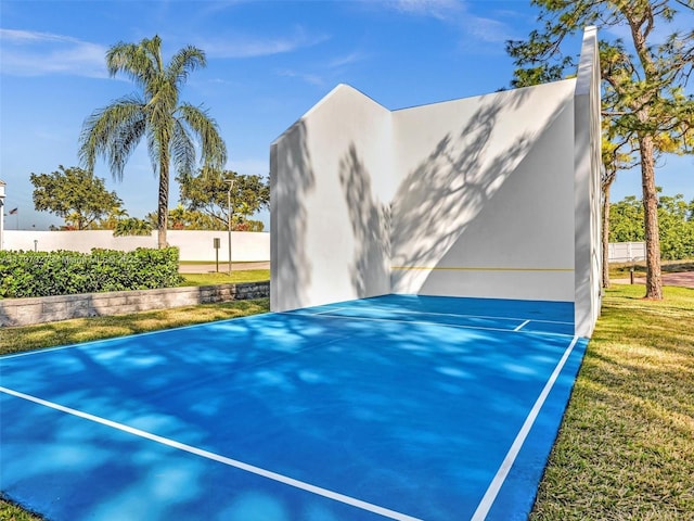 374 Tilford R Unit 374, Deerfield Beach, FL 33442 - view of property exterior with fence, stucco siding, and basketball hoop