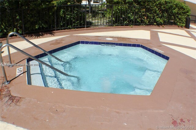 17021 N Bay Rd Unit 105, Sunny Isles Beach, FL 33160 - view of swimming pool featuring a swimming pool