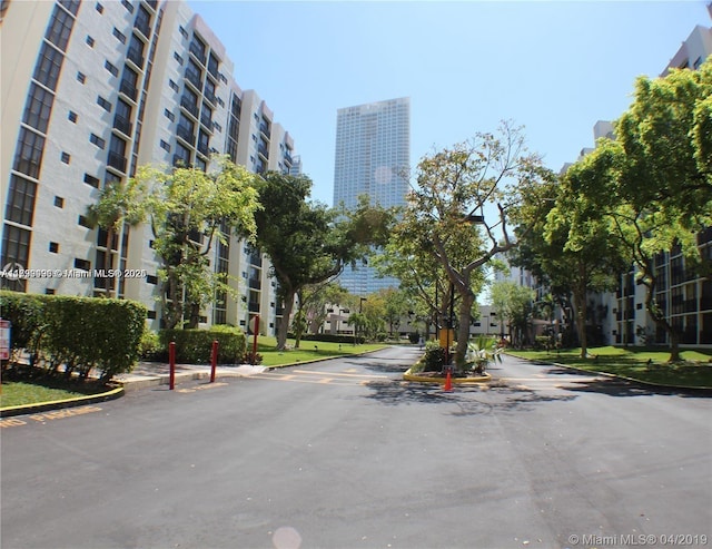 17021 N Bay Rd Unit 105, Sunny Isles Beach, FL 33160 - view of asphalt road featuring curbs