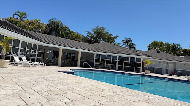 community pool featuring a patio area
