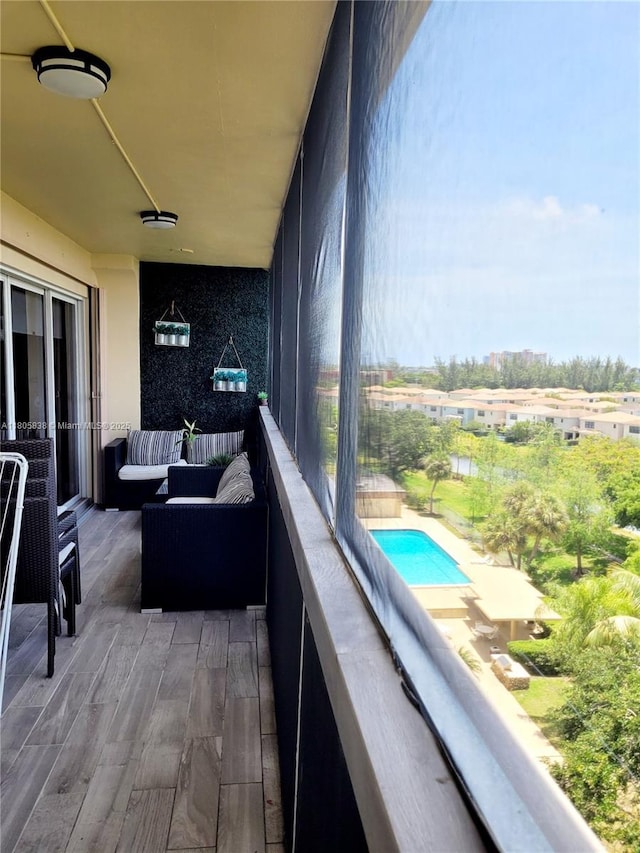 800 NE 195th St Unit 720, Miami, FL 33179 - balcony with view of pool and outdoor lounge area