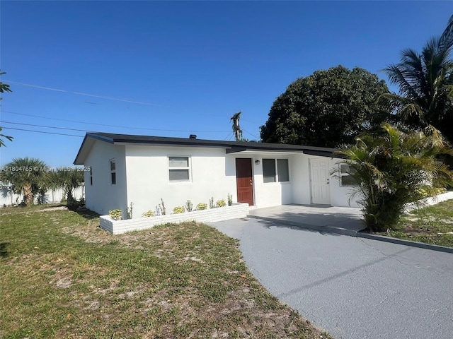 18740 NW 42nd Pl, Miami Gardens, FL 33055 - ranch-style house featuring stucco siding and a front lawn