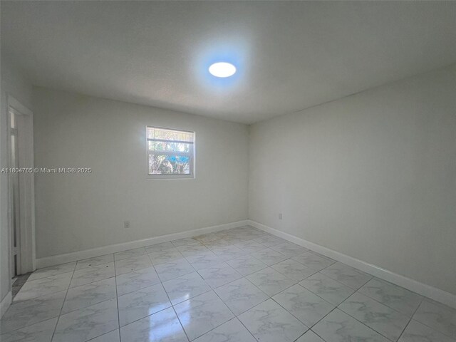 18740 NW 42nd Pl, Miami Gardens, FL 33055 - spare room with light marble finish floors and baseboards