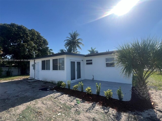 18740 NW 42nd Pl, Miami Gardens, FL 33055 - back of property with french doors and stucco siding