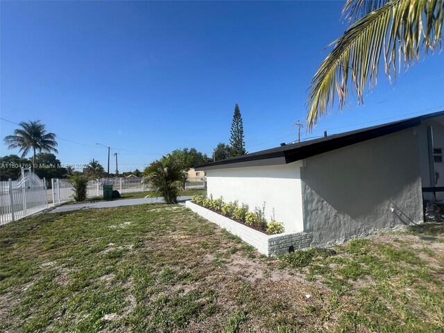 18740 NW 42nd Pl, Miami Gardens, FL 33055 - view of yard featuring a patio area