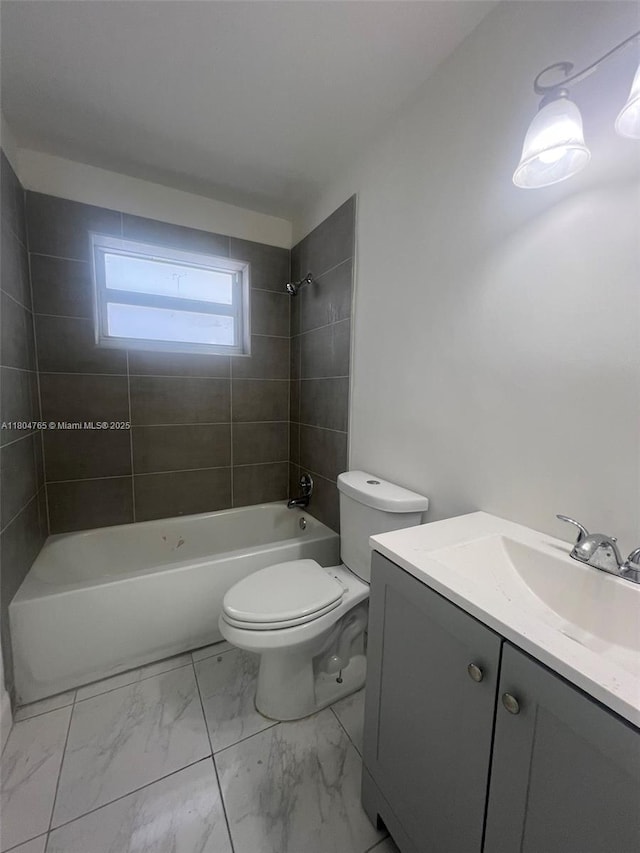 18740 NW 42nd Pl, Miami Gardens, FL 33055 - bathroom featuring vanity, marble finish floors, toilet, and washtub / shower combination