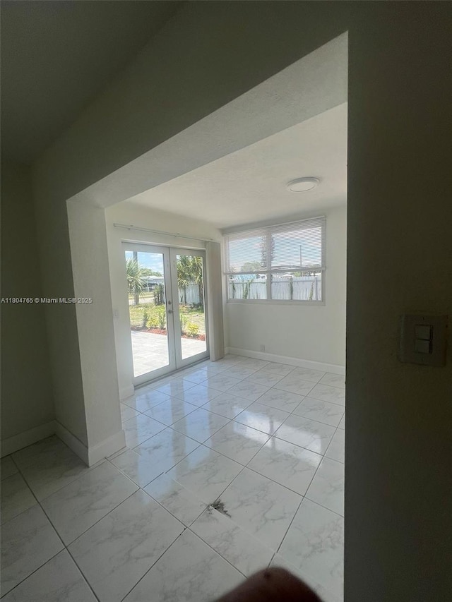 18740 NW 42nd Pl, Miami Gardens, FL 33055 - unfurnished room featuring light marble finish flooring and baseboards