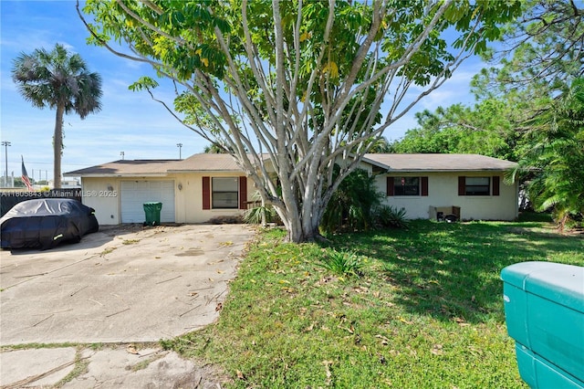 280 Palm Blvd, Merritt Island, FL 32952 - ranch-style house featuring stucco siding, an attached garage, a front yard, and concrete driveway