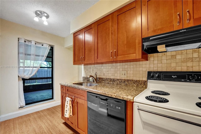 1561 NW 98th Ter, Pembroke Pines, FL 33024 - kitchen featuring electric range, black dishwasher, a sink, under cabinet range hood, and light wood-type flooring