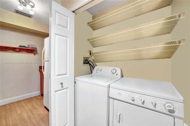 1561 NW 98th Ter, Pembroke Pines, FL 33024 - clothes washing area with separate washer and dryer, light wood-type flooring, and baseboards