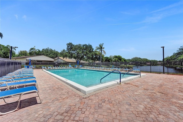1561 NW 98th Ter, Pembroke Pines, FL 33024 - community pool featuring fence and a patio